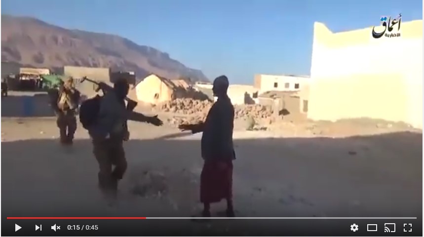 A remaining Qandala resident greets an ISIS fighter (Uploaded on Youtube via Radio Qandala)
