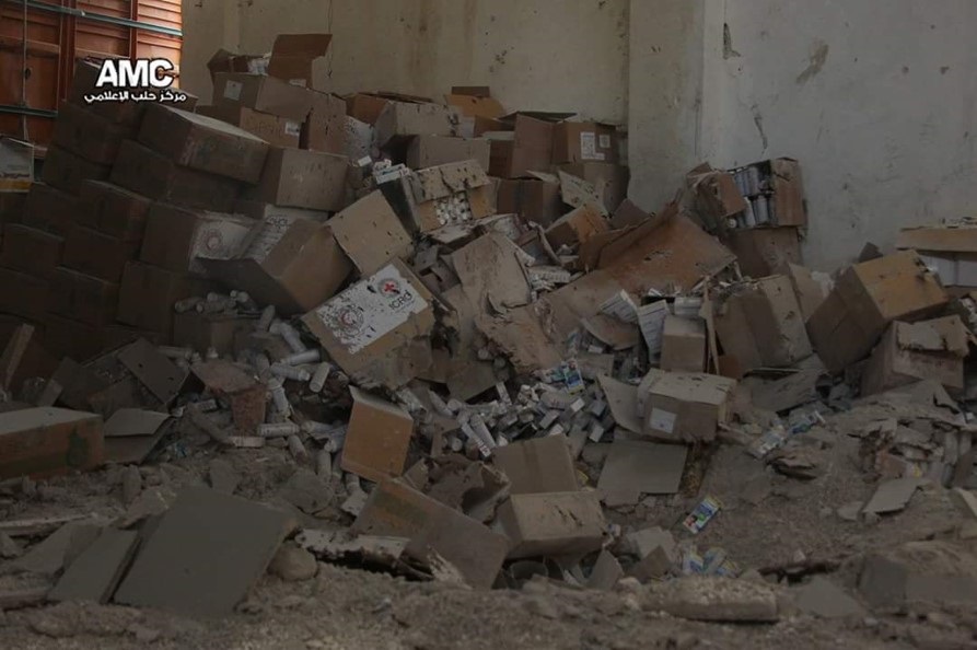 Fig 13 - Example of crater with fragmentation visible in cardboard boxes to rear