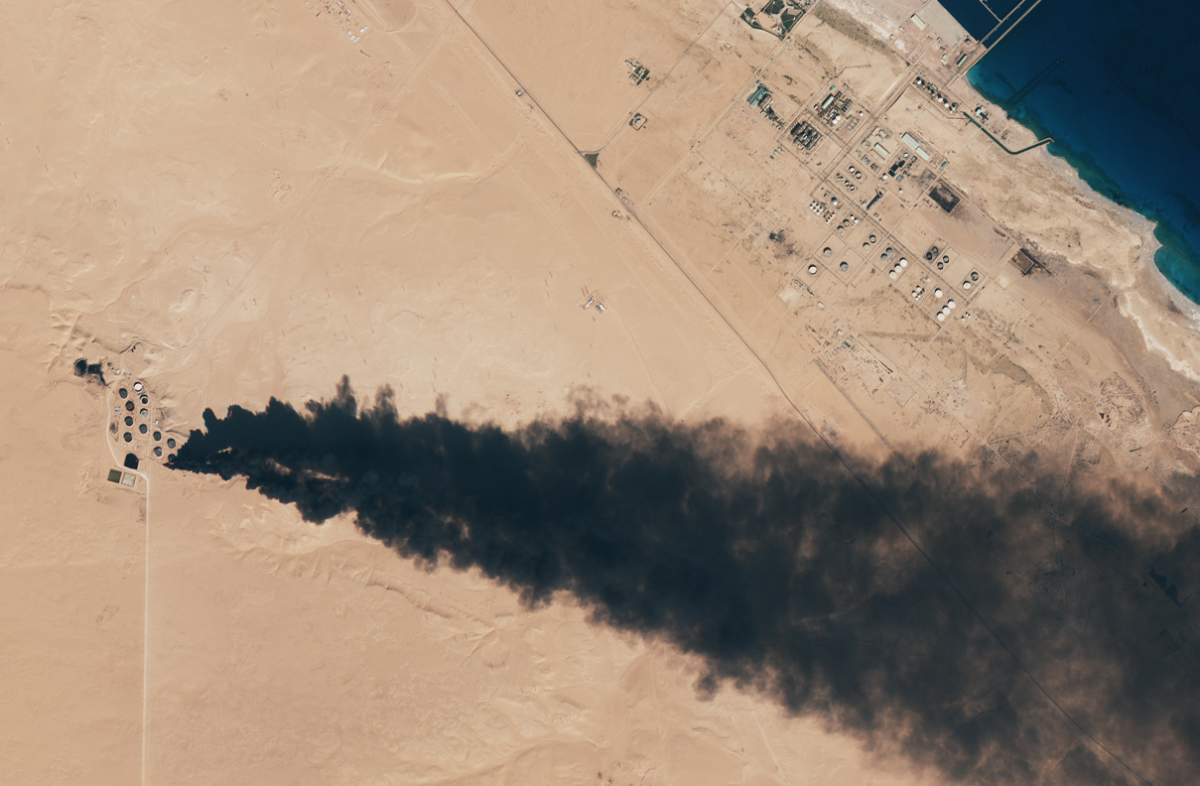 Burning oil storage tanks south of Ras Lanuf, January 6, 2015. Image by NASA