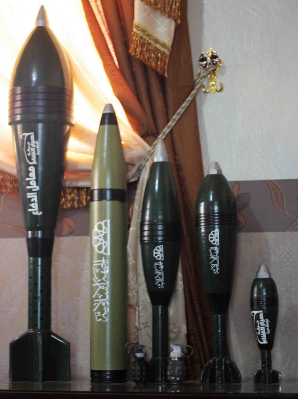 A variety of large and small Jaish al-Islam mortar rounds and a Jaish al-Is...