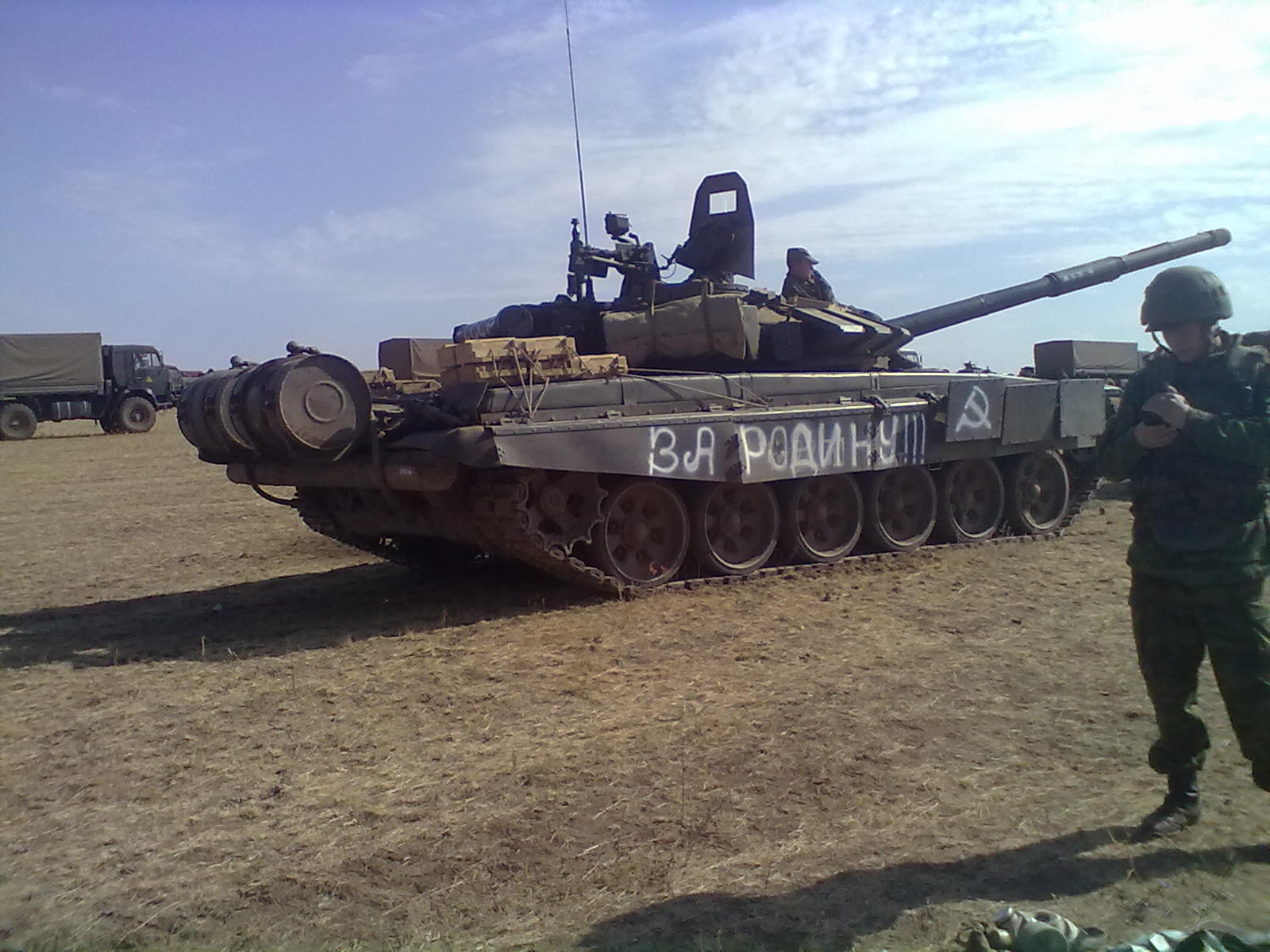 T-72B3 tank with an unknown number (likely 824) and the inscription "FOR THE MOTHERLAND!!!" on the right side. Archive / Original