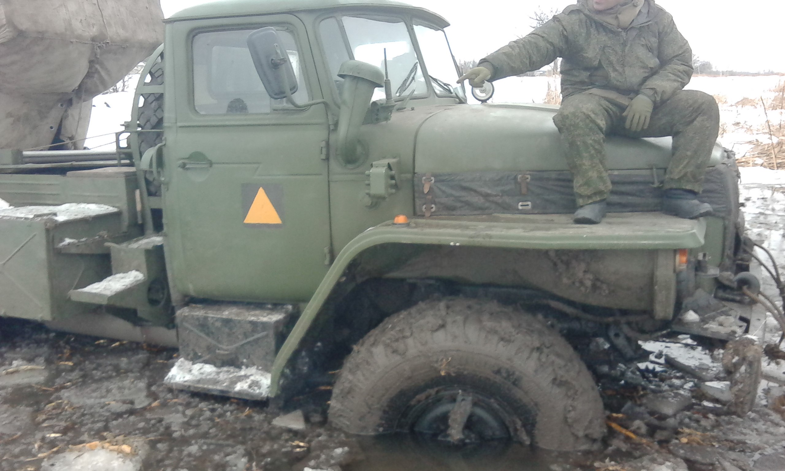 MLRS BM-21 Grad with the 200th Brigade's yellow equilateral triangle on the doors. Archive / Original