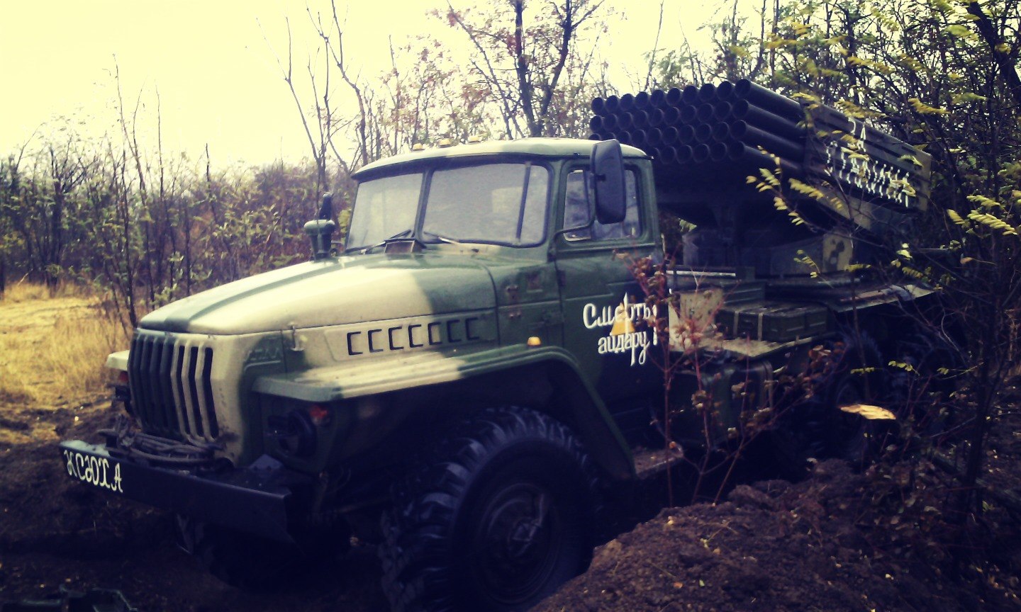 MLRS BM-21 Grad with the 200th Brigade's yellow triangle on the door, the phrases "Death to Aidar!" on the doors, "Ksyukha" on the front bumper, and "For Stalin!" on the left side of the missile launcher. Archive / Original