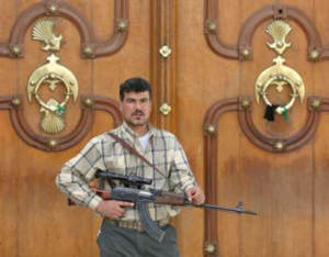 A combatant holding what appears to be a Tabuk sniper rifle
