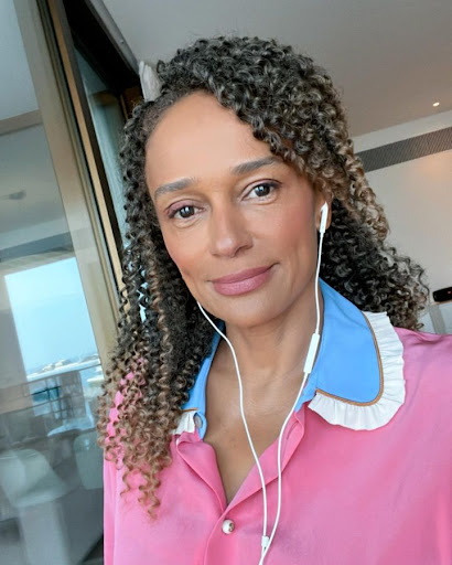 Two pictures of dos Santos wearing a matching outfit of pink blouse. One from a still from a DW Africa interview the other a Selfie from Instagram.